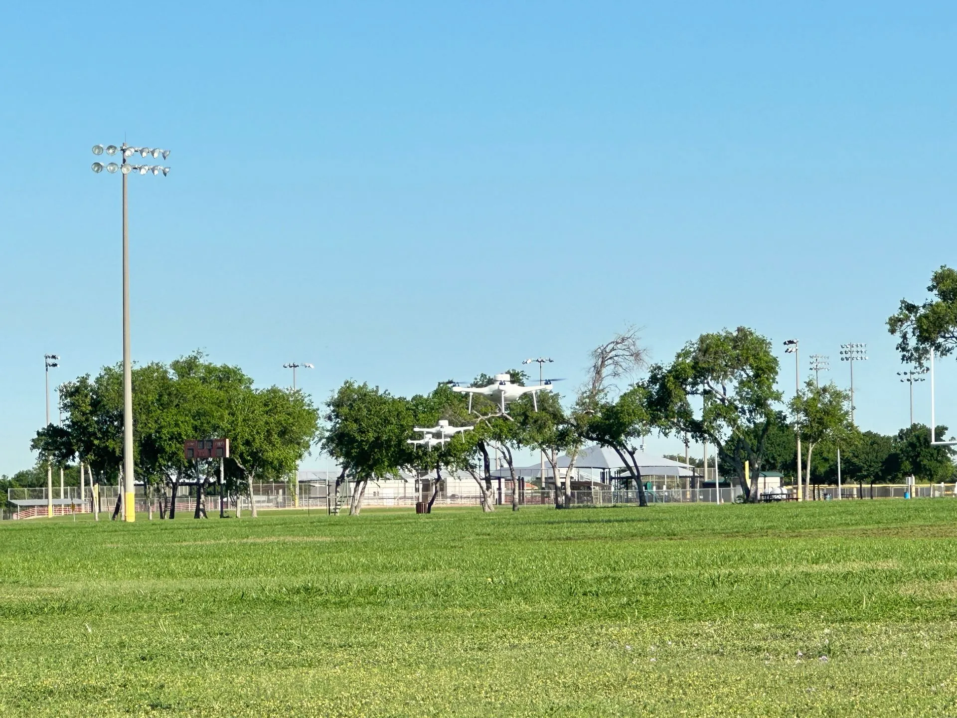 Robota RG3 show drones in flight over a field during daytime testing